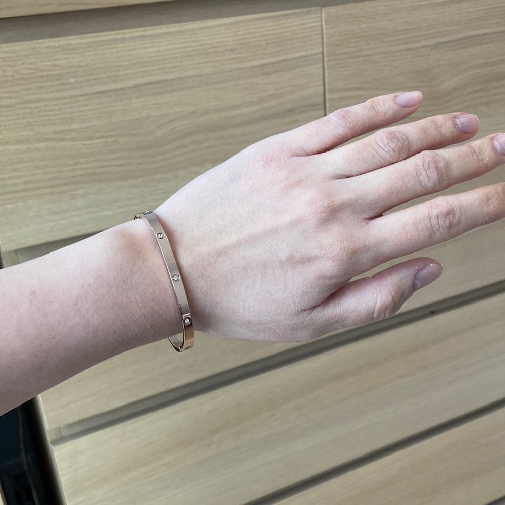 Rose Toned Stainless Steel Bangle Bracelet with Crystals and Hinge Clasp